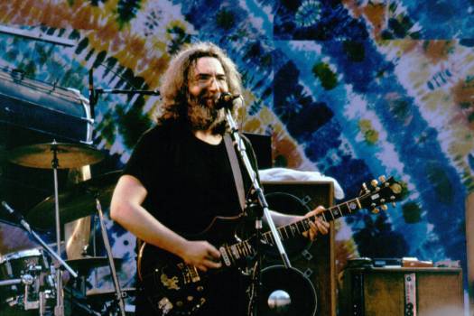 Berkeley - July 15:   Jerry Garcia with the Grateful Dead perform at the Greek Theater in Berkeley, California on July 15, 1984. (Photo by Larry Hulst/Michael Ochs Archives/Getty Images)