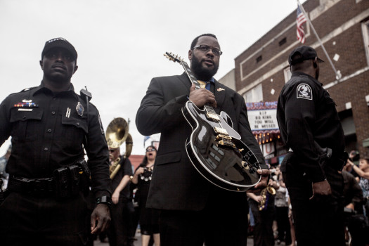 MEMPHIS, TN - MAY 27: Rodd Bland, son of blues legend Bobby Bland, carries Lucille, one of B.B. King's beloved guitars, at the front of the processional down Beale Street following the memorial in honor of B.B. King on May 27, 2015 in Memphis, TN. King passed away on May 14, 2015 at the age of 89. (Photo by Andrea Morales/Getty Images)
