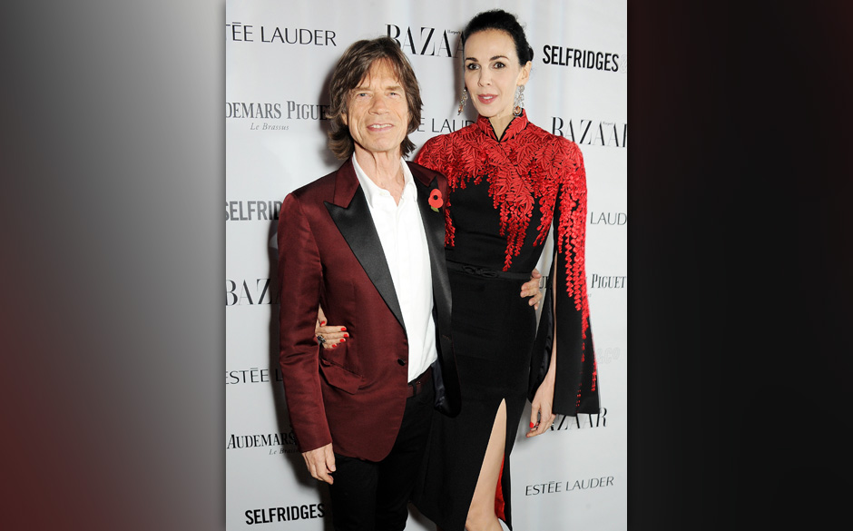 LONDON, ENGLAND - NOVEMBER 05:  Sir Mick Jagger (L) and L'Wren Scott arrive at the Harper's Bazaar Women of the Year award...