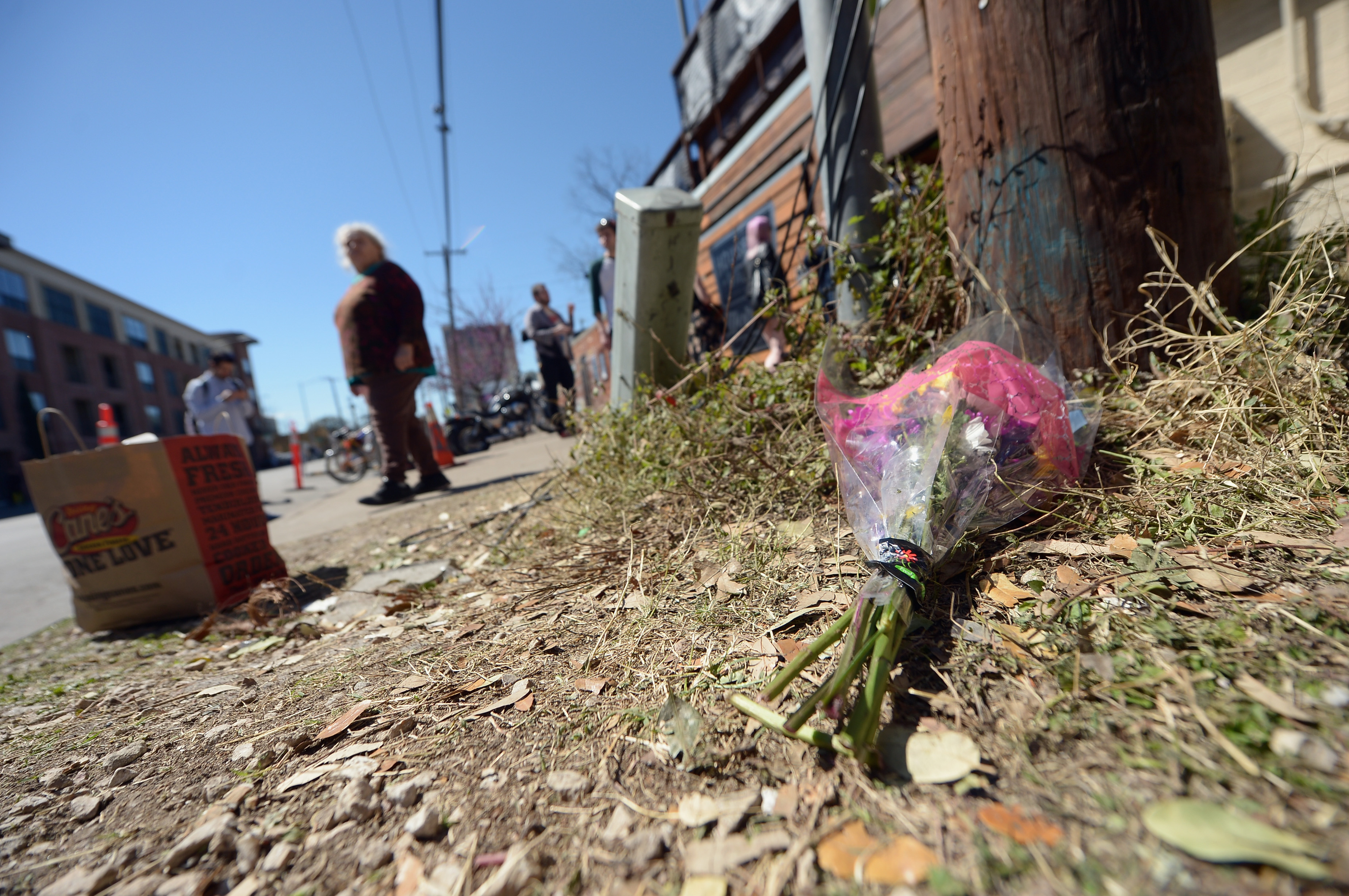 AUSTIN, TX - MARCH 13:  Flowers lie on the ground near the scene of a deadly car accident at the South by Southwest Music,...