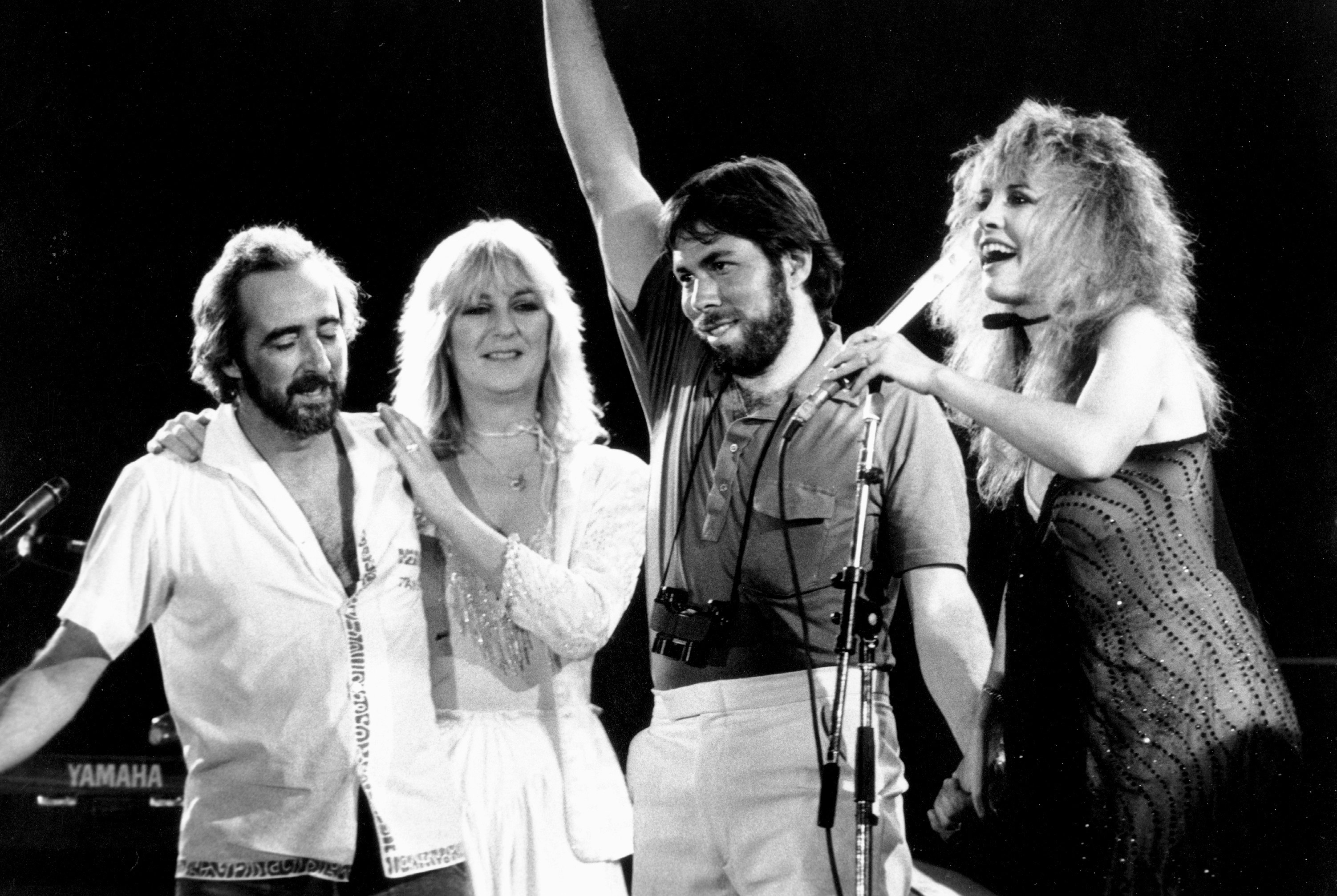 SAN BERNARDINO, CA - MAY 1983:  (L-R) John McVie, Christine McVie, organizer and executive Steve Wozniak and Stevie Nicks ...