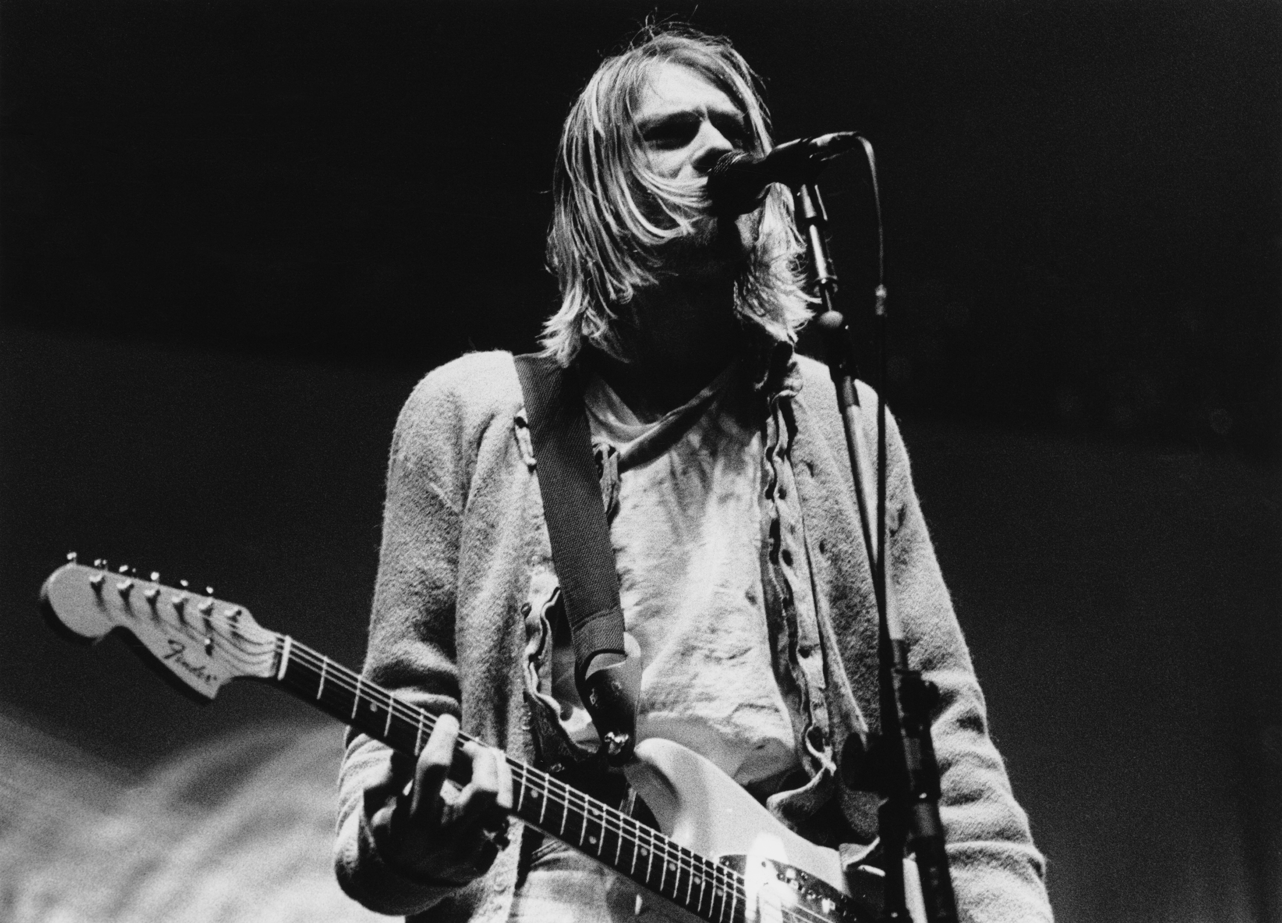 Singer-songwriter and guitarist Kurt Cobain (1967 - 1994) performing with American grunge band Nirvana at Palasport, Moden...