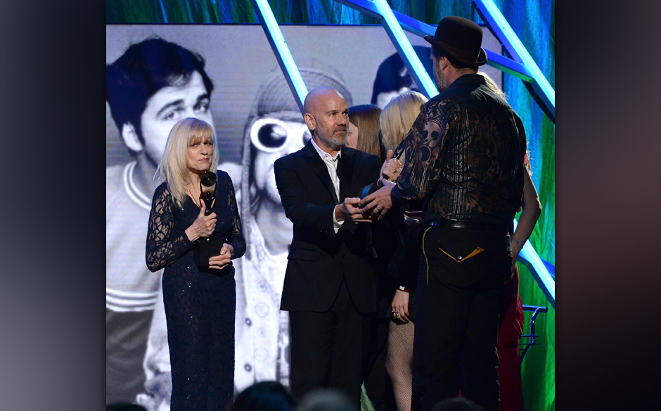 NEW YORK, NY - APRIL 10:  Michael Stipe (C) honors Krist Novoselic of Nirvana onstage with Wendy O'Connor at the 29th Annu...