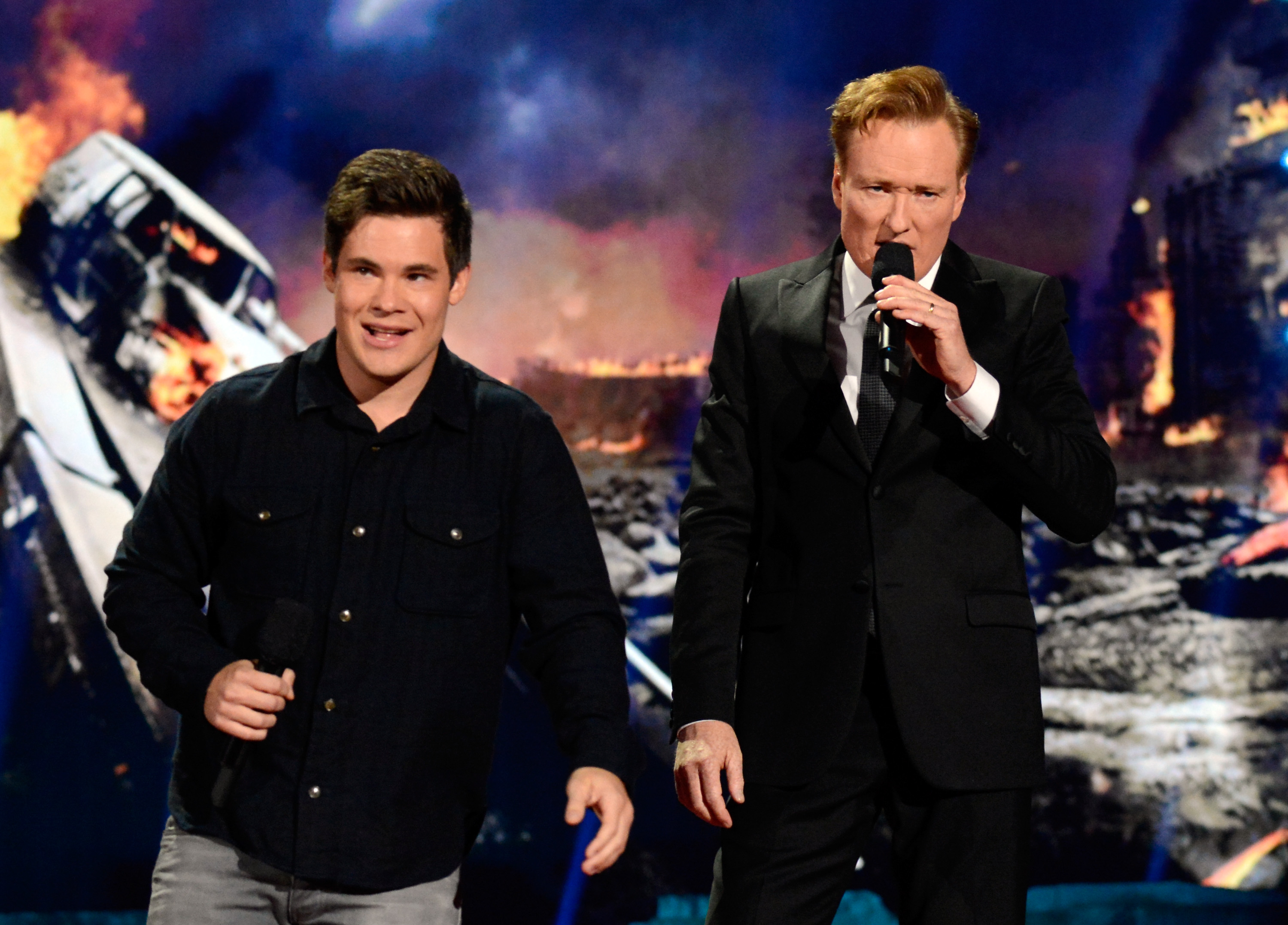 LOS ANGELES, CA - APRIL 13:  Actor Adam DeVine (L) and host Conan O'Brien speak onstage at the 2014 MTV Movie Awards at No...