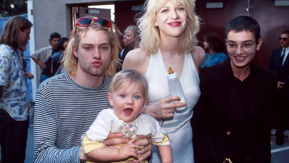 Kurt Cobain of Nirvana (right) with wife Courtney Love and daughter Frances Bean Cobain, and Sinead O'Connor at the Universal