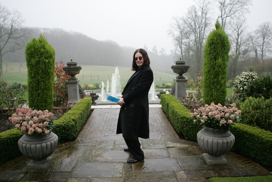 BUCKINGHAMSHIRE, ENGLAND - MARCH 30: Ozzy Osbourne plays the fool with the symbolic blue brick as he films the video for t...