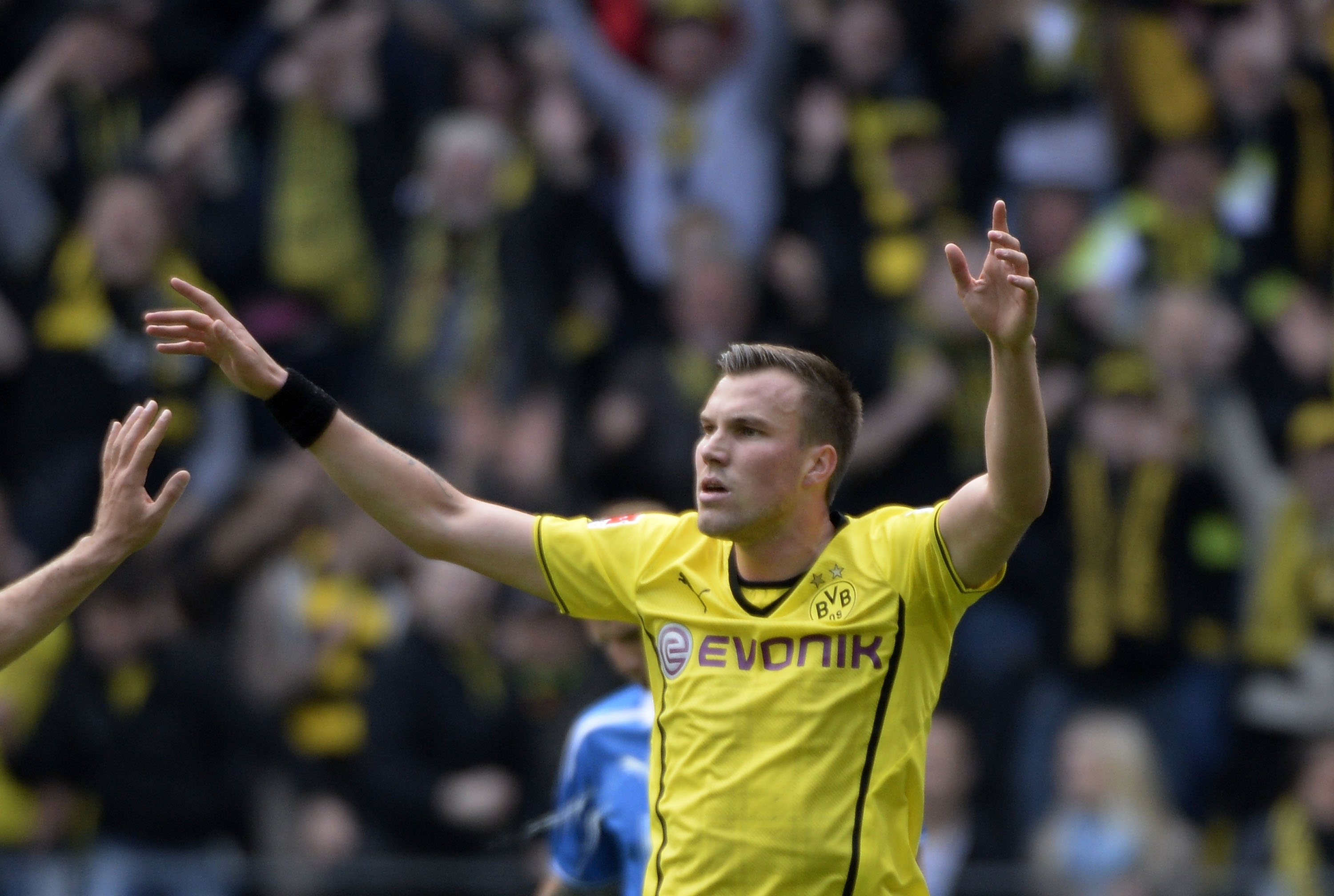 DORTMUND, GERMANY - MAY 03:  Kevin Grosskreutz of Dortmund celebrates after scoring his teams opening goal  during the Bun...