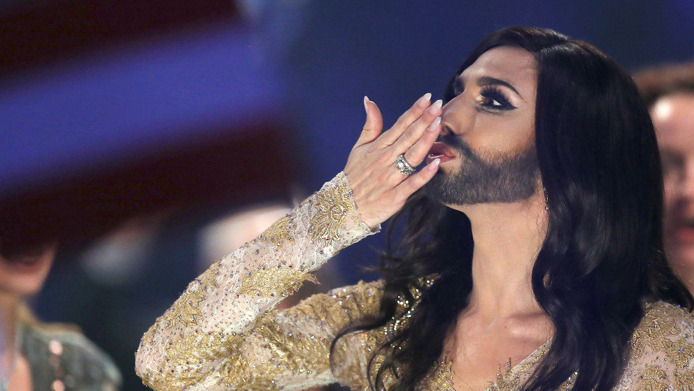 Conchita Wurst representing Austria celebrates after the second semifinal of the Eurovision Song Contest in the B&W Halls