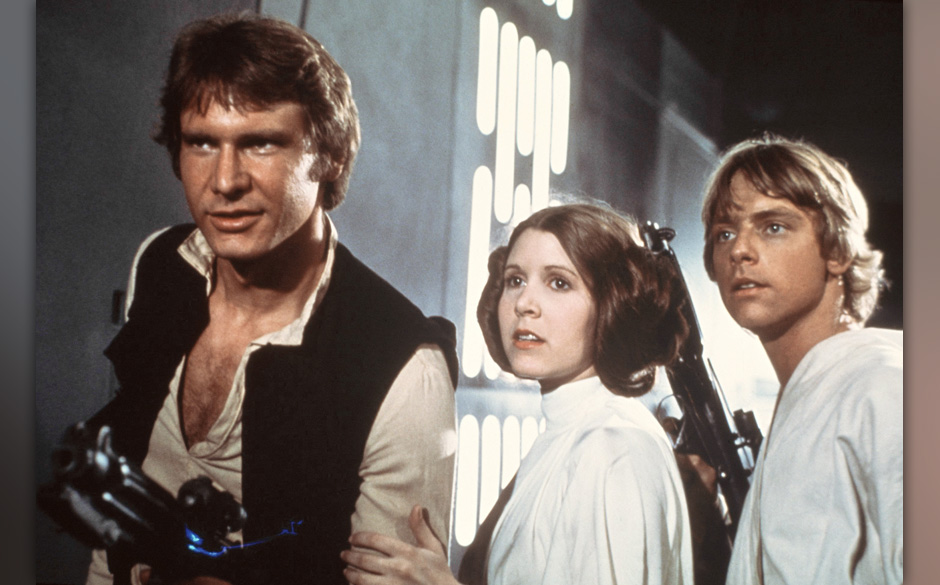 FILE - This 1977 file image provided by 20th Century-Fox Film Corporation ahows, from left, Harrison Ford, Carrie Fisher, ...