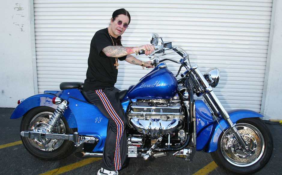 Ozzy Osbourne signs a 2003 Boss Hoss motorcycle for B.A.D.D. -Bikers Against Drunk Drivers to be given away in a raffle. M...