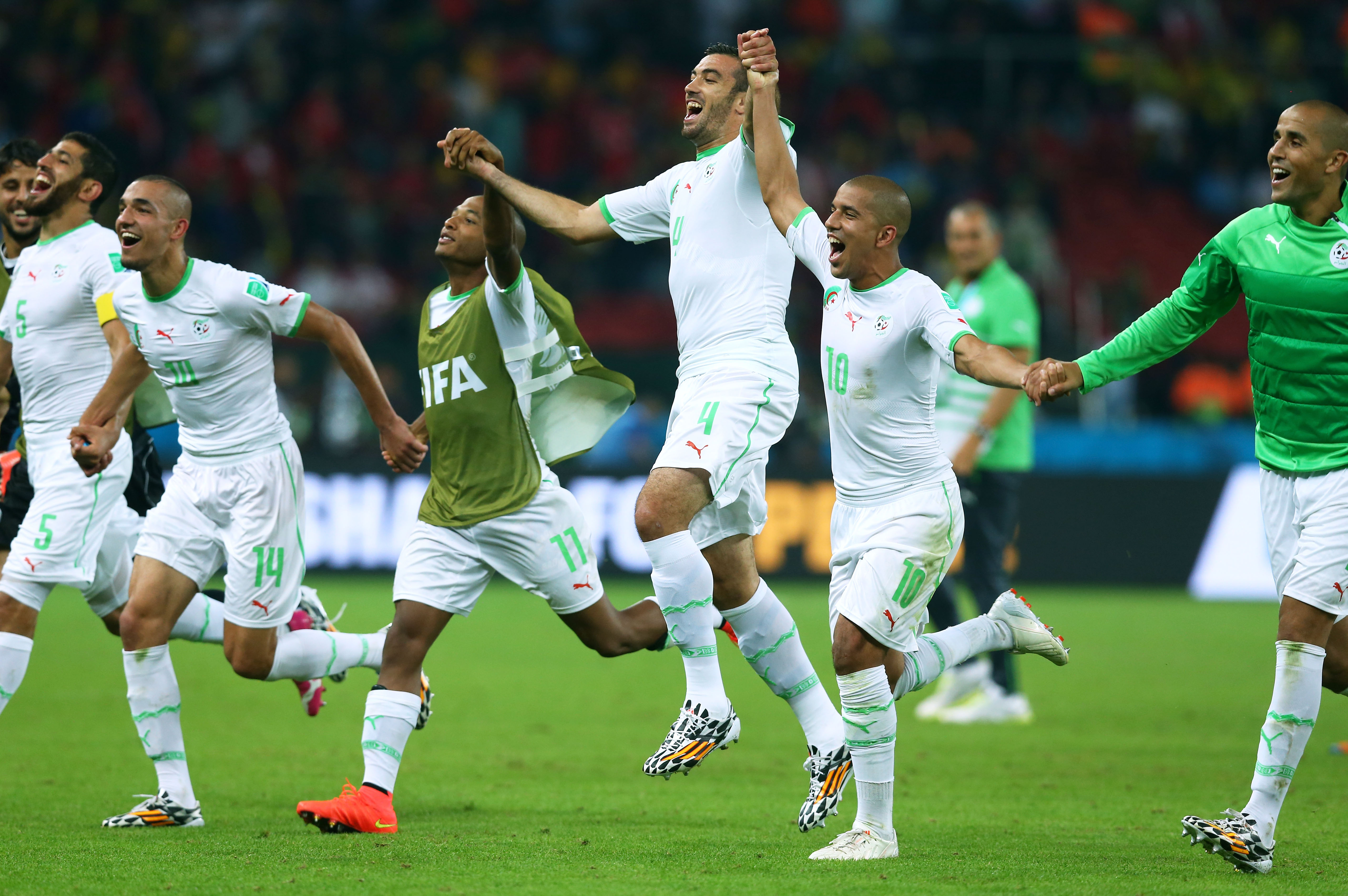 PORTO ALEGRE, BRAZIL - JUNE 22:  Algeria celebrate after defeating South Korea 4-2 during the 2014 FIFA World Cup Brazil G...