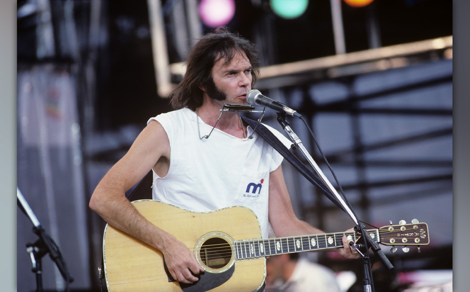 PHILADELPHIA, USA - 13th JULY: Canadian singer/songwriter Neil Young perofrms live on stage at Live Aid in Philadelphia, P...