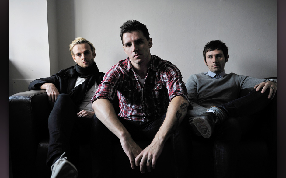 (L-R) Lee Gaze, Stuart Richardson and Mike Lewis of Welsh hard rock group Lostprophets being interviewed for Total Guitar ...