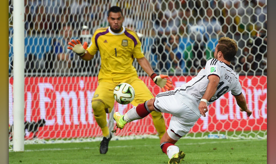 RIO DE JANEIRO, BRAZIL - JULY 13:  Mario Goetze of Germany scores his team's first goal past Sergio Romero of Argentina in ex