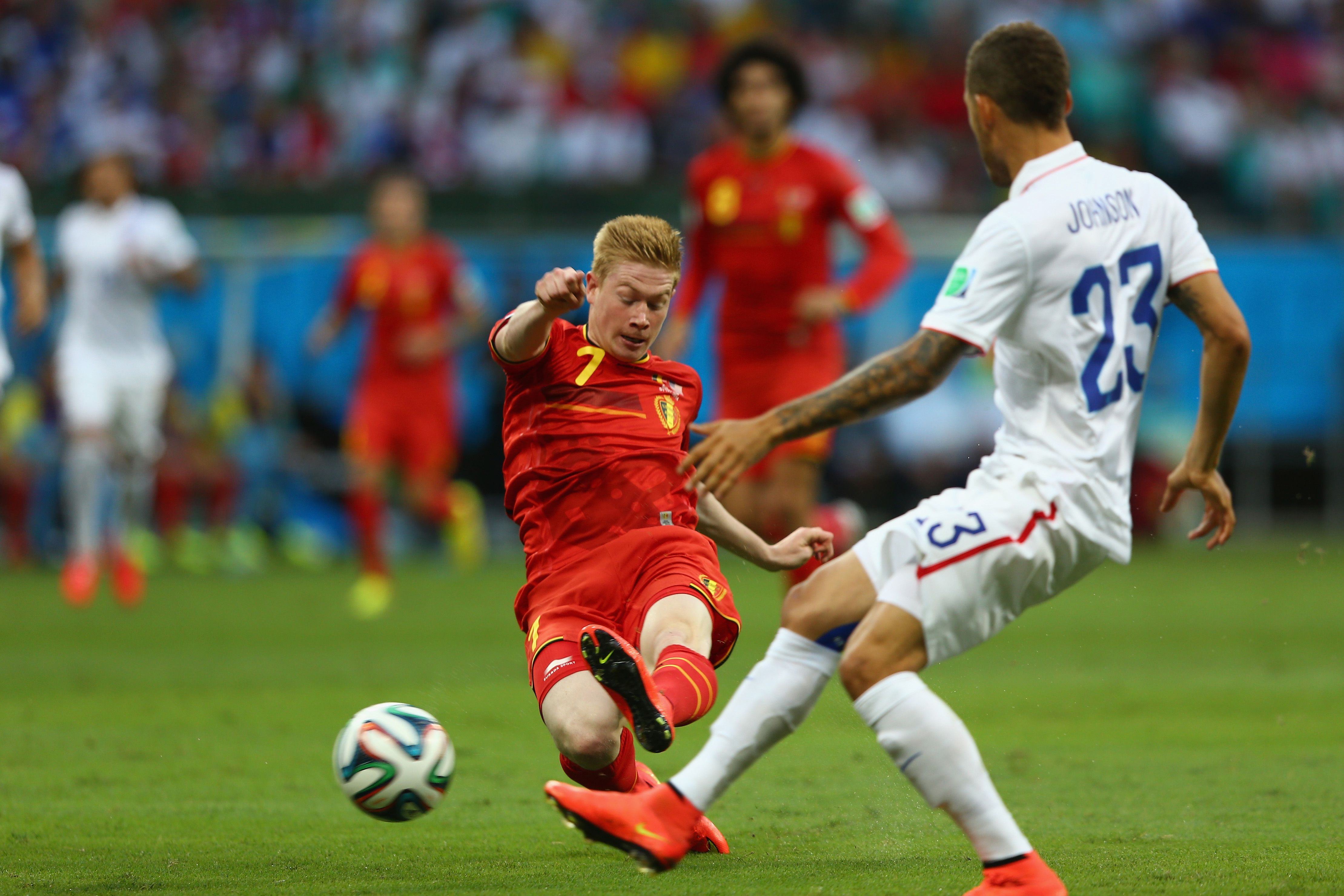 SALVADOR, BRAZIL - JULY 01:  Kevin De Bruyne of Belgium shoots as Fabian Johnson of United States closes in during the 201...