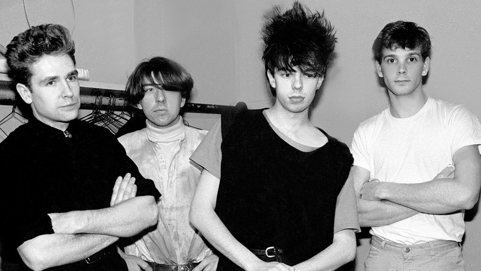 Portrait of British band Echo and the Bunnymen as they pose backstage at the Park West Auditorium, Chicago, Illinois, March 2