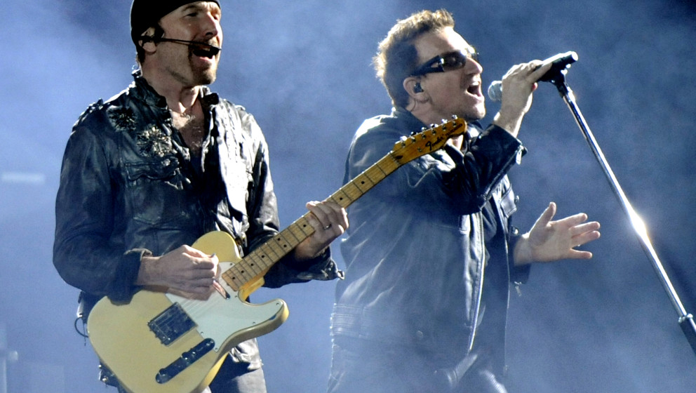 OAKLAND, CA - JUNE 7: The Edge (L) and Bono of U2 perform in support of the bands' U2 360 Tour at Overstock.com Coliseum on J