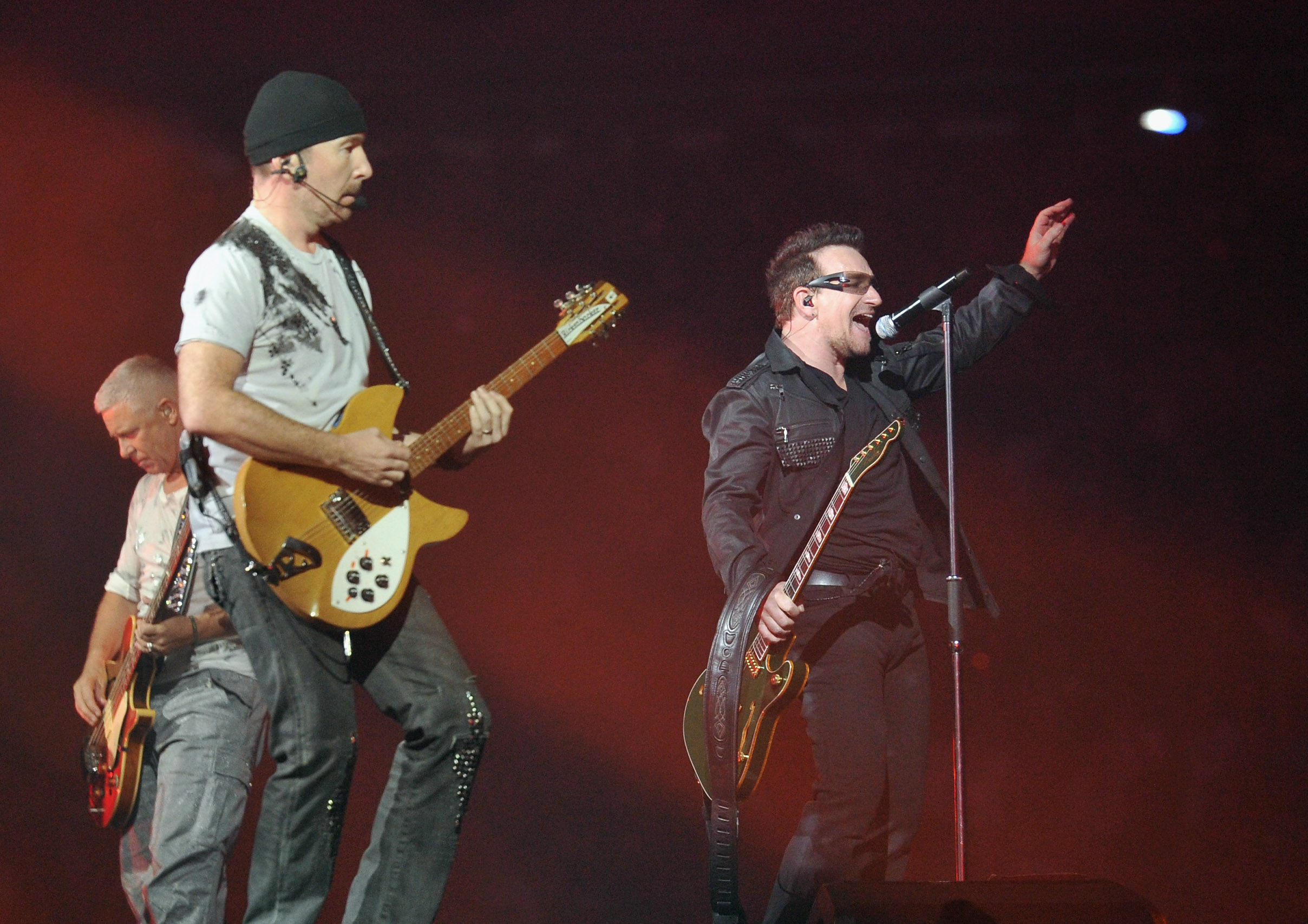 EAST RUTHERFORD, NJ - JULY 20: (L-R) U2 bass player Adam Clayton, guitar player The Edge and lead singer Bono perform at t...