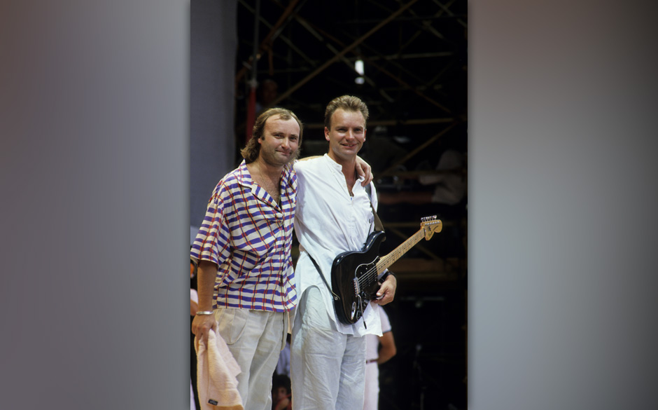 LONDON, UNITED KINGDOM - JULY 13:  Singers Sting (R) and Phil Collins perform at the Live Aid concert at Wembley Stadium i...