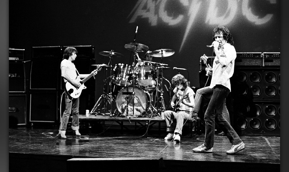 HOLLYWOOD - CIRCA 1977:  Rhythm guitarist Malcolm Young, drummer Phil Rudd, lead guitarist Angus Young, and singer Bon Scott 