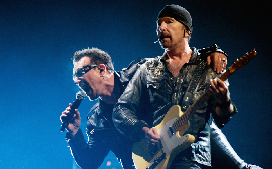 GLASTONBURY, ENGLAND - JUNE 24:  Bono (L) and The Edge of U2 headline the Pyramid Stage at the Glastonbury Festival at Wor...