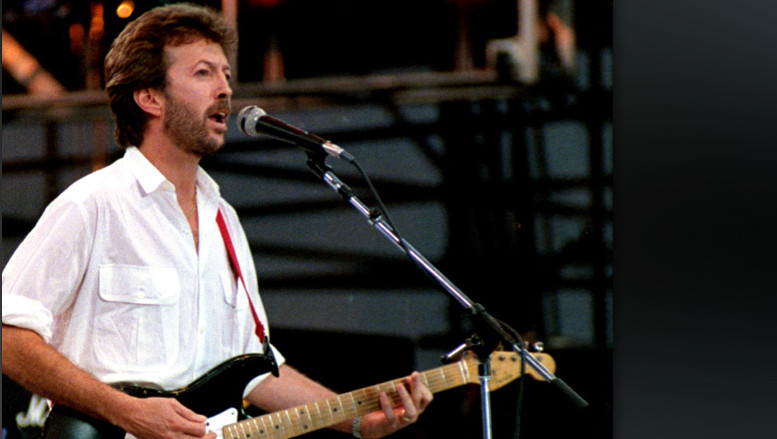 UNITED STATES - JULY 13:  Photo of LIVE AID and Eric CLAPTON; performing live onstage at Live Aid, playing 'Blackie' Fender S