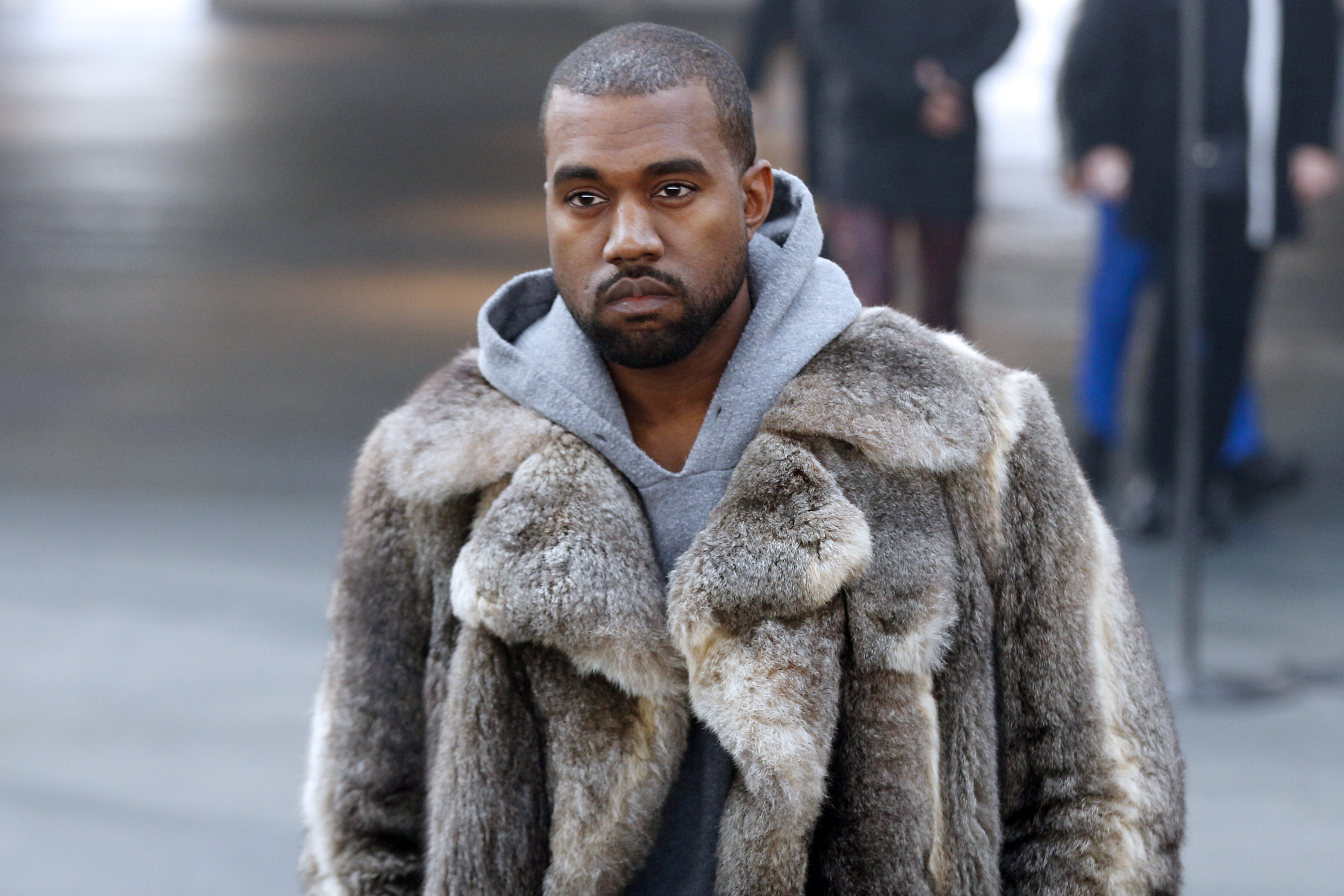 US musician Kanye West arrives to attend Givenchy's Fall/Winter 2014-2015 men's fashion show in Paris on January 17, 2014....