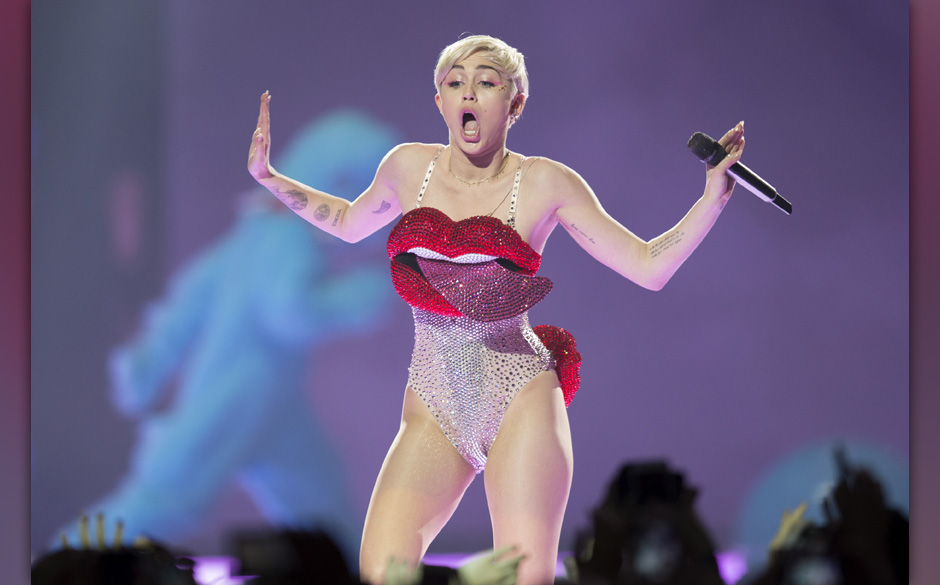 In this picture made available on Tuesday, May 27, 2014 US singer Miley Cyrus performs during a concert in Cologne, German...
