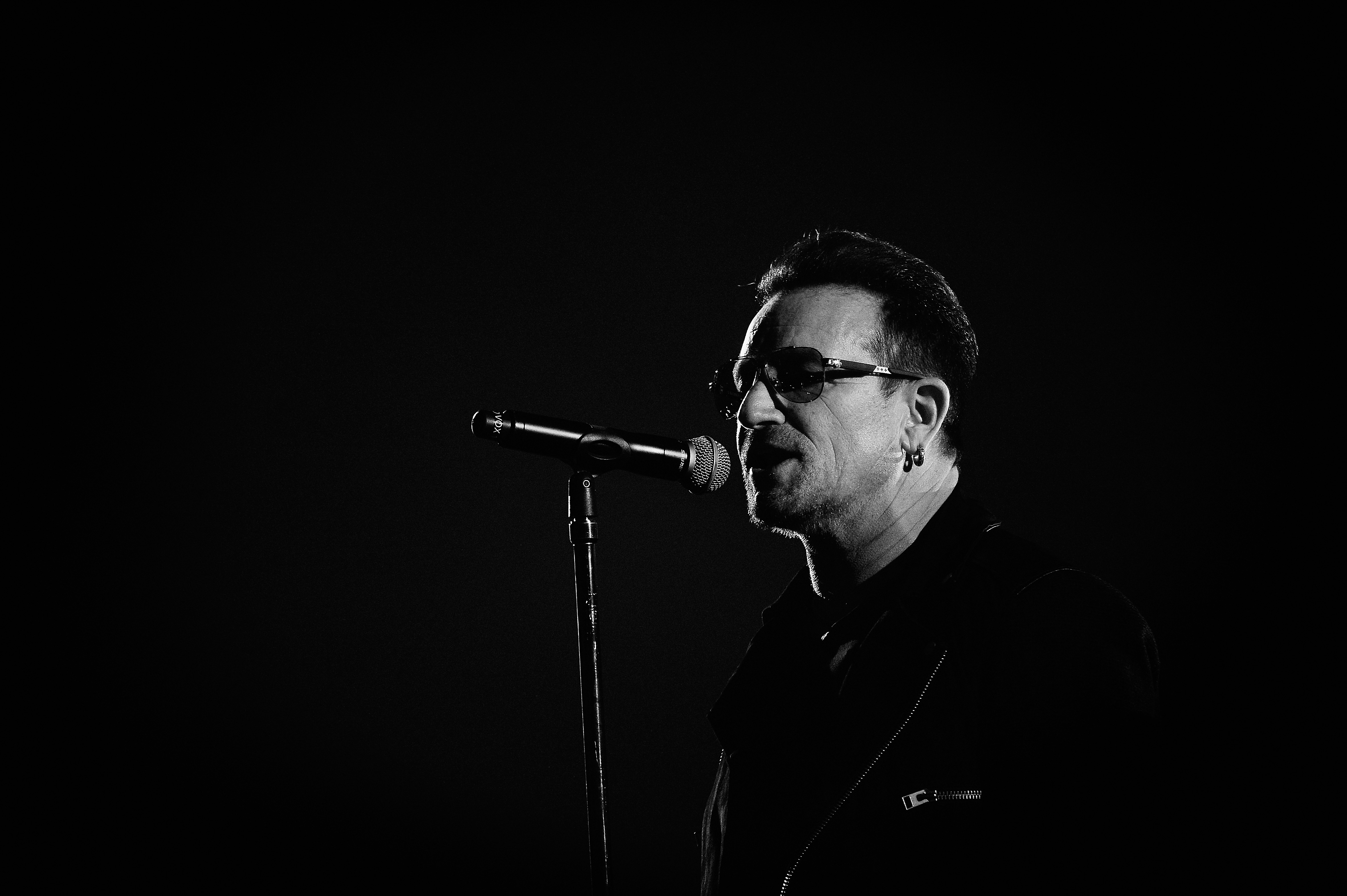 GLASGOW, SCOTLAND - NOVEMBER 09: (EDITORS NOTE: Image has been converted to black and white)  An alternative view of Bono ...