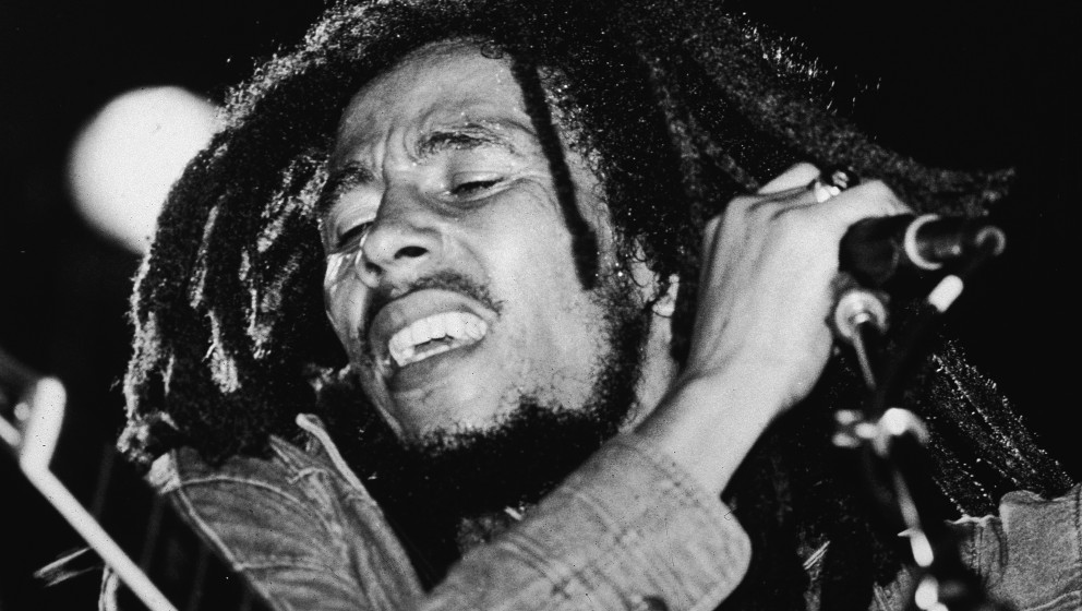 Jamaican reggae musician Bob Marley (1945 - 1981) performs on stage, a microphone in his hand, late 1970s. (Photo by Express 