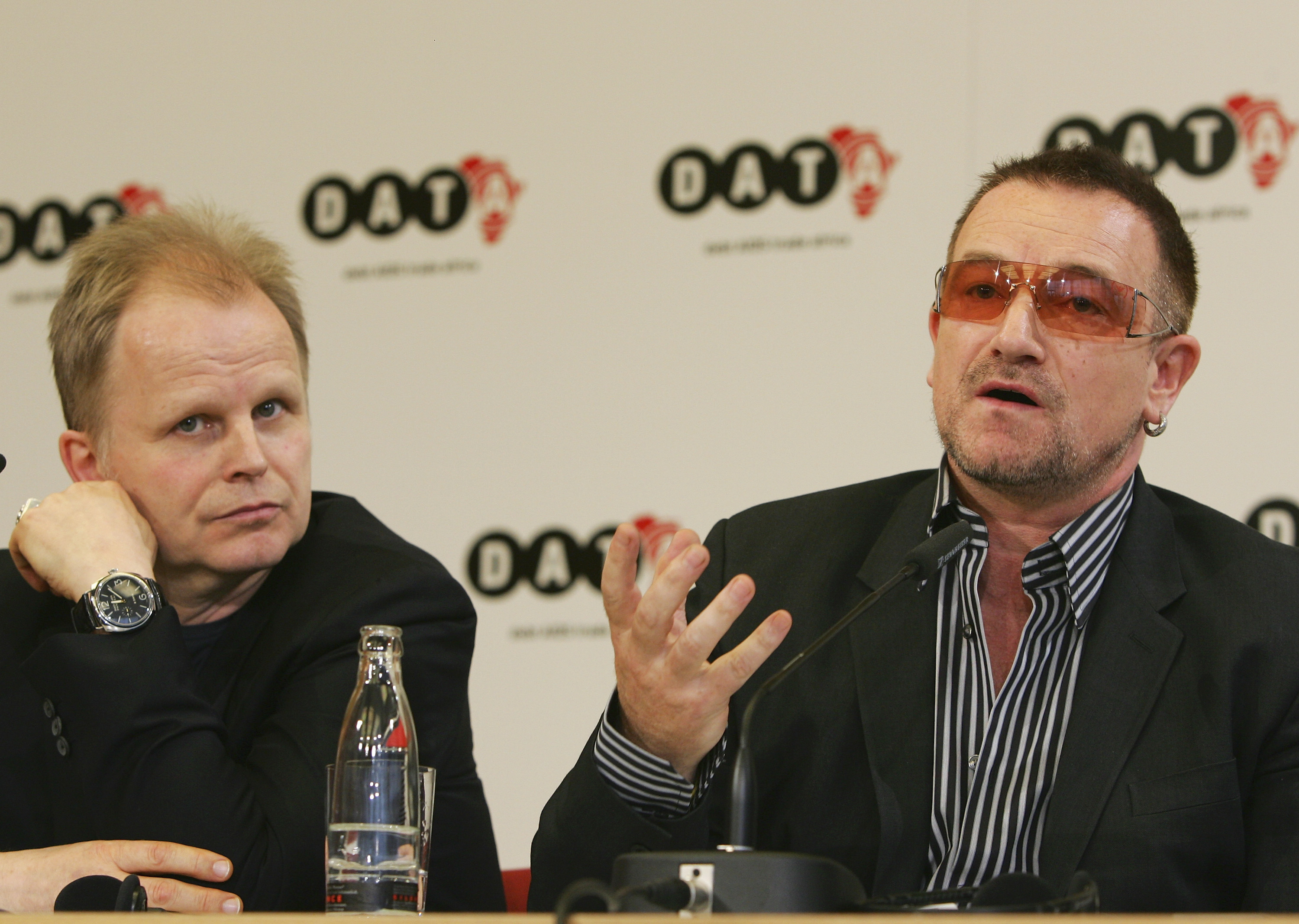 BERLIN - MAY 15:  Musicians Bono (R) and Herbert Groenemeyer speak during a news conference after the presentation of DATA...