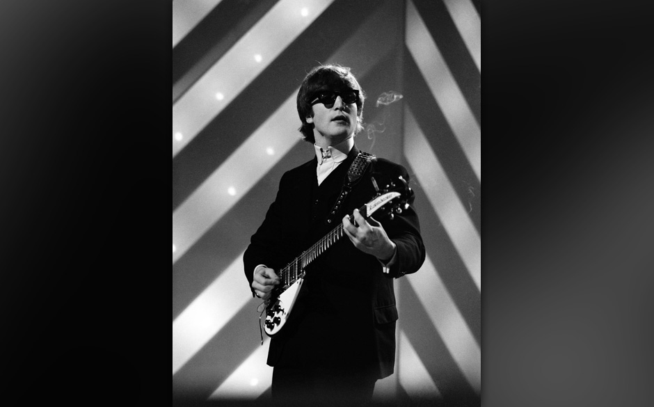 UNITED KINGDOM - JULY 11:  Photo of BEATLES and John LENNON; with The Beatles, performing, wearing sunglasses, playing his...