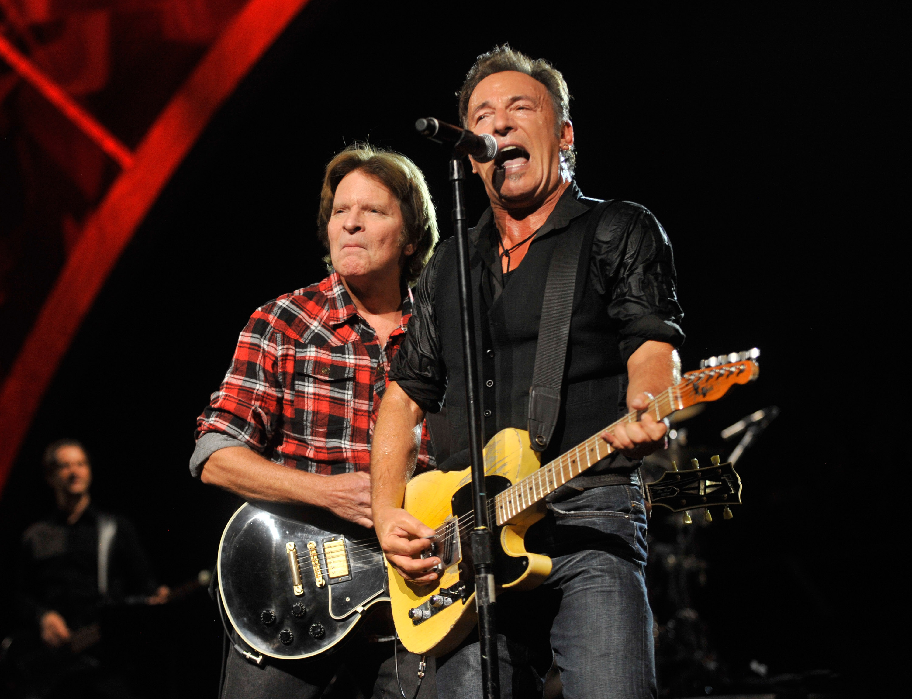 NEW YORK - OCTOBER 29:  John Fogerty and Bruce Springsteen performs on stage for the 25th Anniversary Rock & Roll Hall of ...