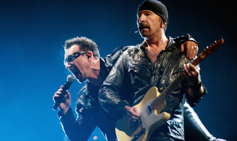 GLASTONBURY, ENGLAND - JUNE 24:  Bono (L) and The Edge of U2 headline the Pyramid Stage at the Glastonbury Festival at Worthy