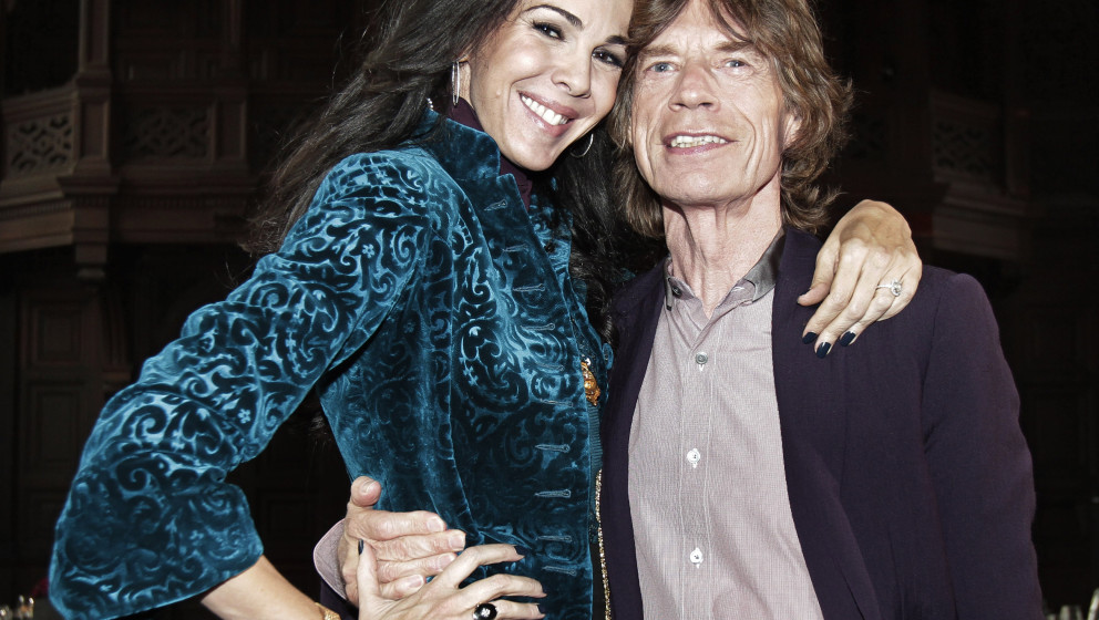 FILE - This Feb. 16, 2012 file photo shows singer Mick Jagger, right, with designer L¿Wren Scott after her Fall 2012 collect