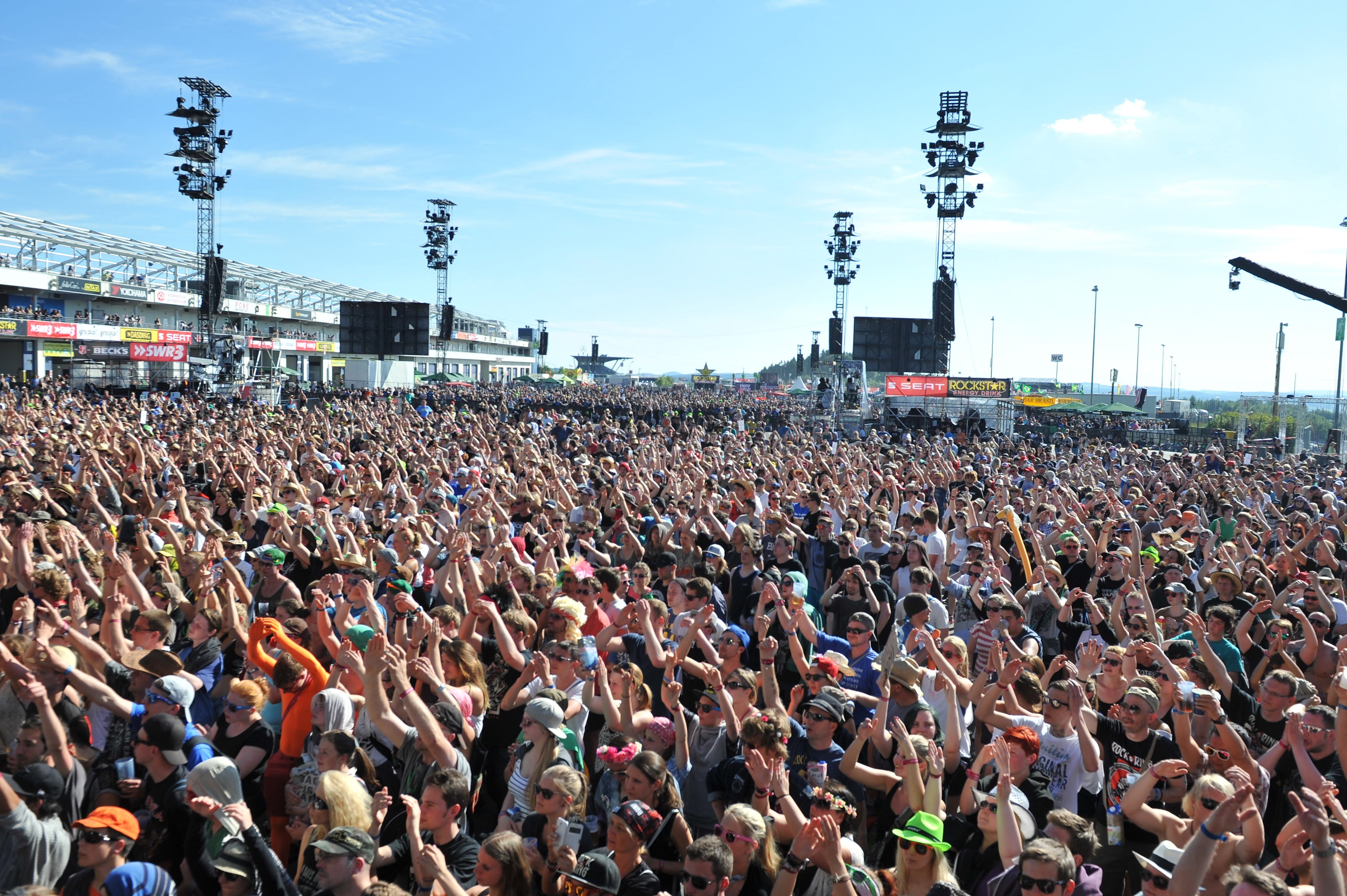 NUERBURG, GERMANY - JUNE 06: Spectators celebrate in front of the centerstage during the second day of 'Rock am Ring'  on ...