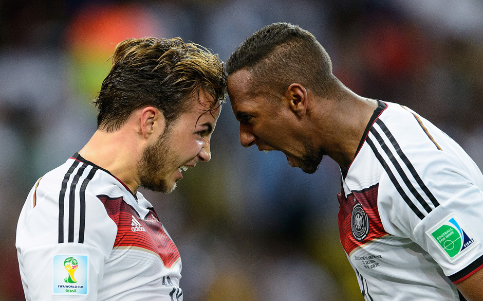 RIO DE JANEIRO, BRAZIL - JULY 13: Mario Goetze of Germany (L) celebrates scoring his team's first goal with Jerome Boateng...