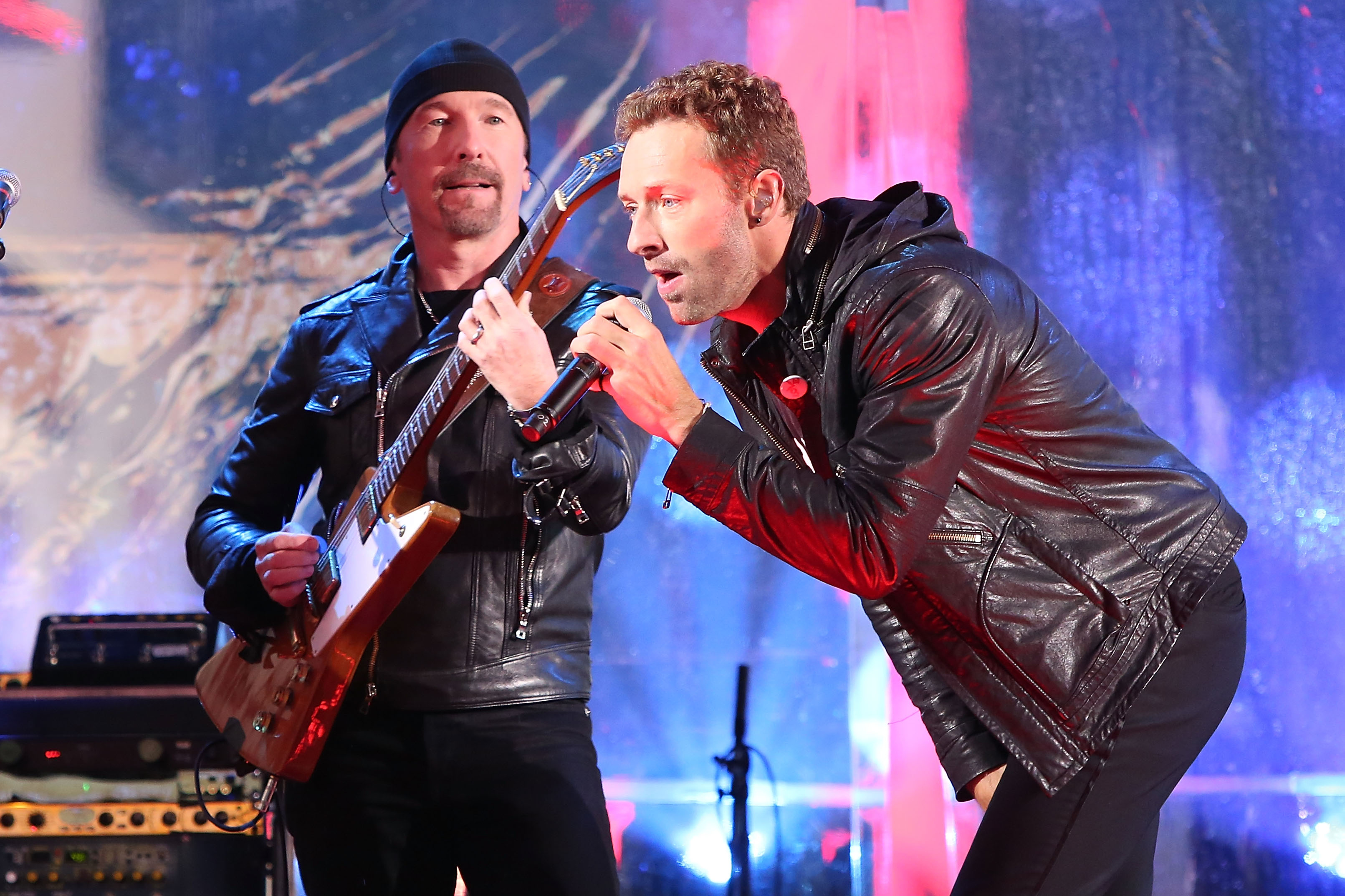 NEW YORK, NY - DECEMBER 01:  The Edge and Chris Martin of Coldplay perform as "U2 - 1" in a surprise concert by (RED) to m...