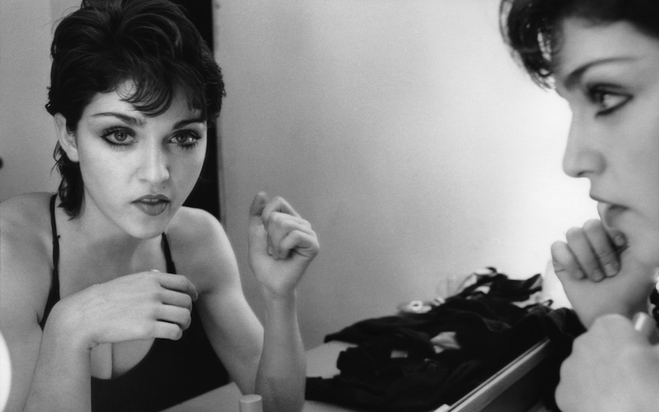American singer Madonna reflected in a dressing room mirror, New York City, Spring 1979. She has recently moved to New Yor...