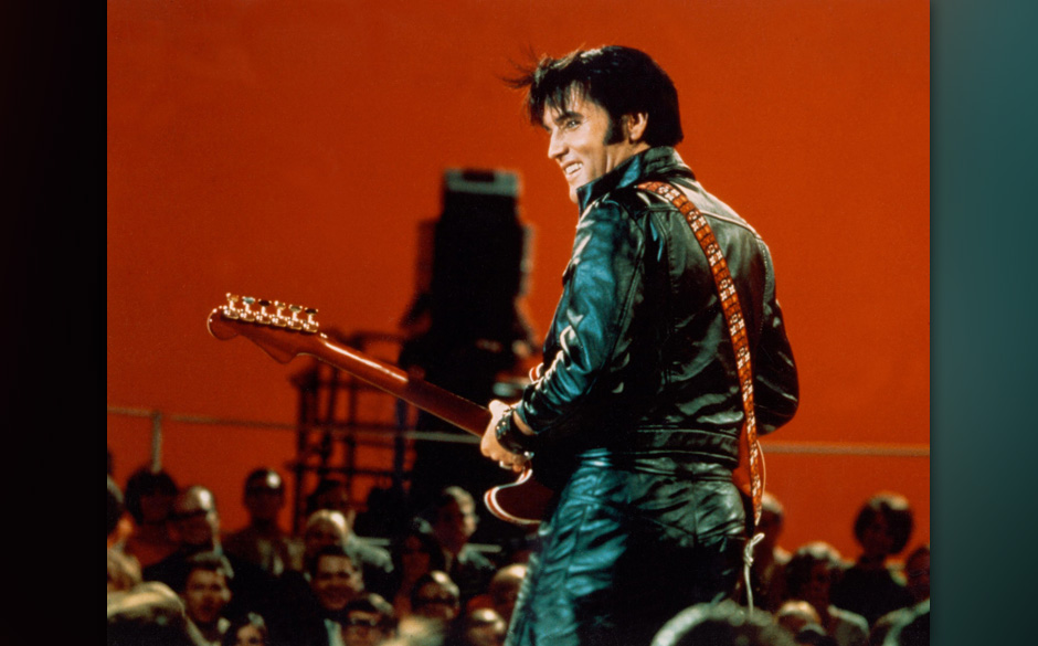 Rock and roll musician Elvis Presley performing