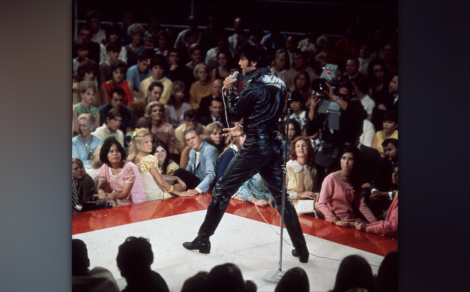 Rock and roll musician Elvis Presley performing