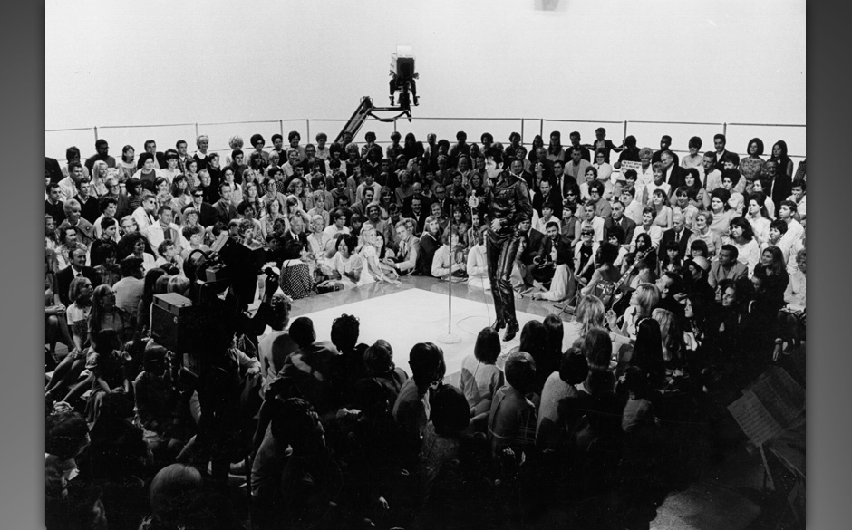 Rock and roll musician Elvis Presley performing