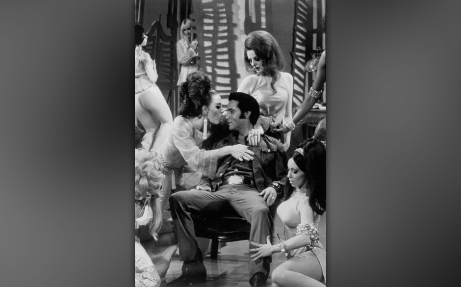 Rock and roll musician Elvis Presley performing