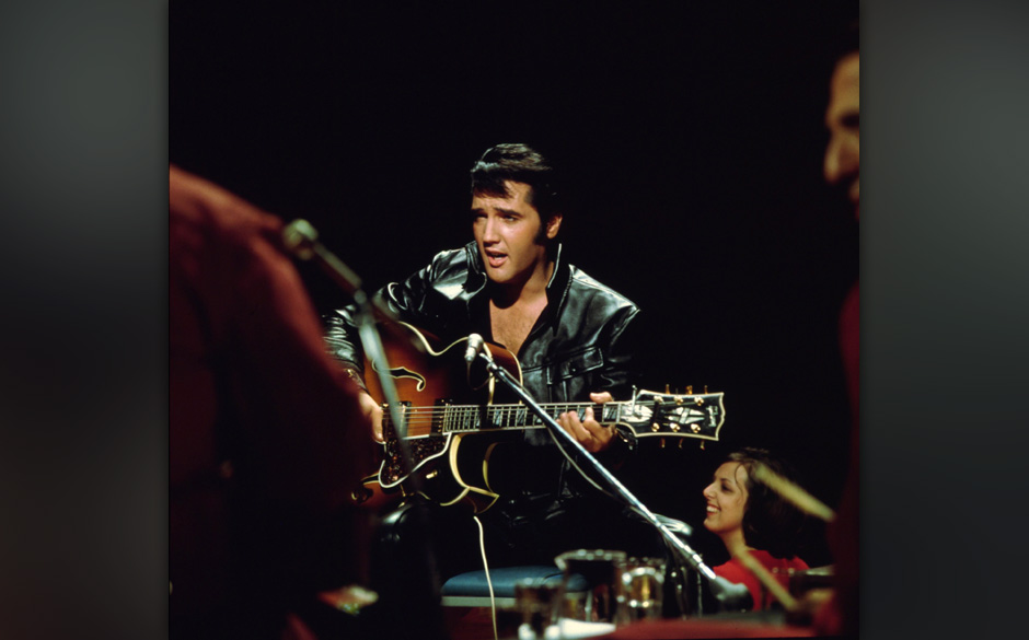 Rock and roll musician Elvis Presley performing
