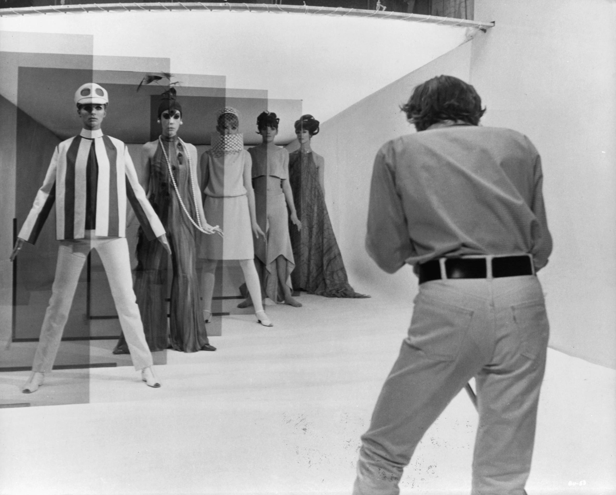 David Hemmings shoots a high fashion session with five models, Jill Kennington, Peggy Moffit, Rosaleen Murray, Ann Norman ...
