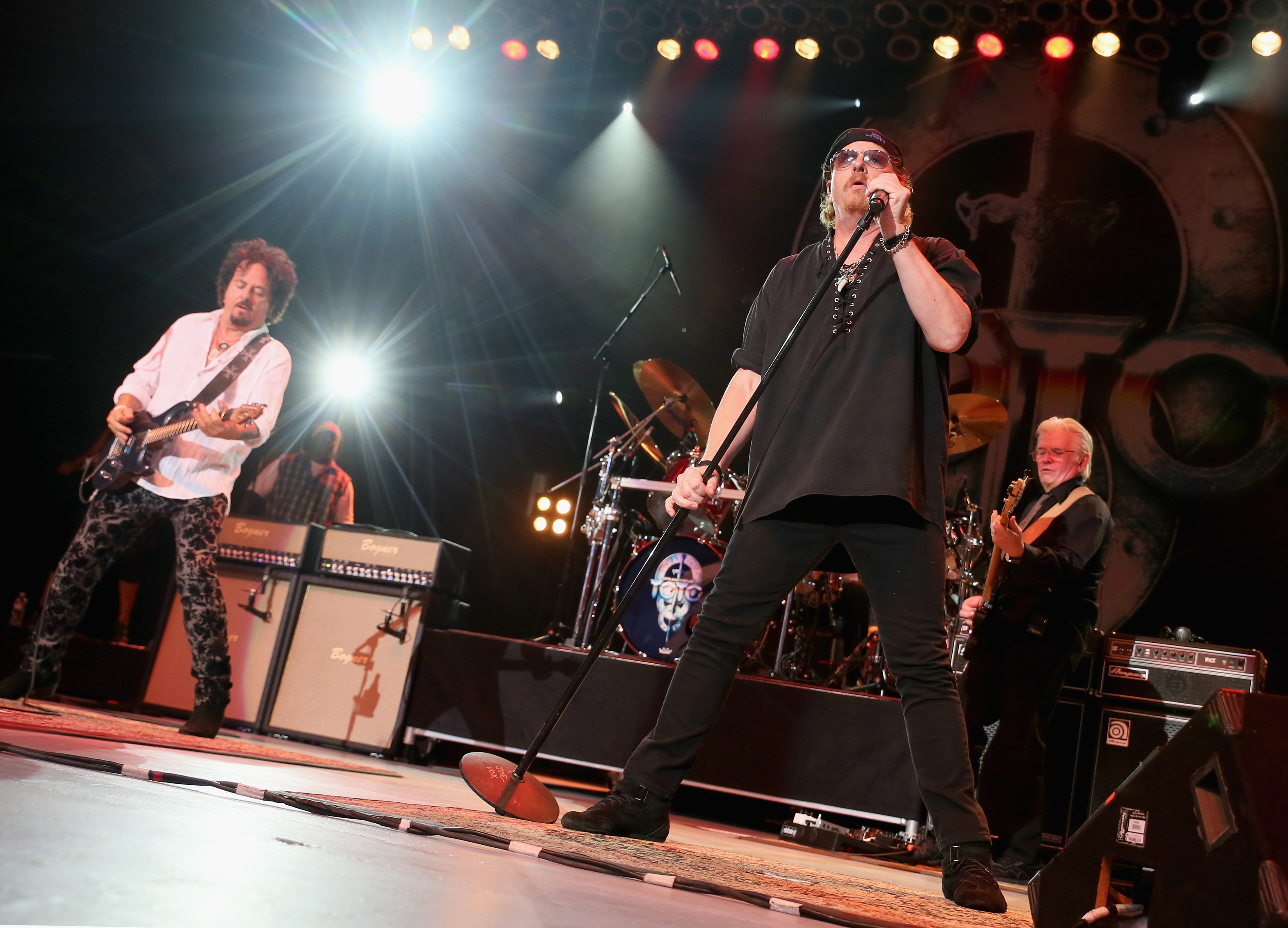 LOS ANGELES, CA - AUGUST 07: (L-R) Steve Lukather, Joseph Williams and David Hungate of Toto perform at The Greek Theatre ...