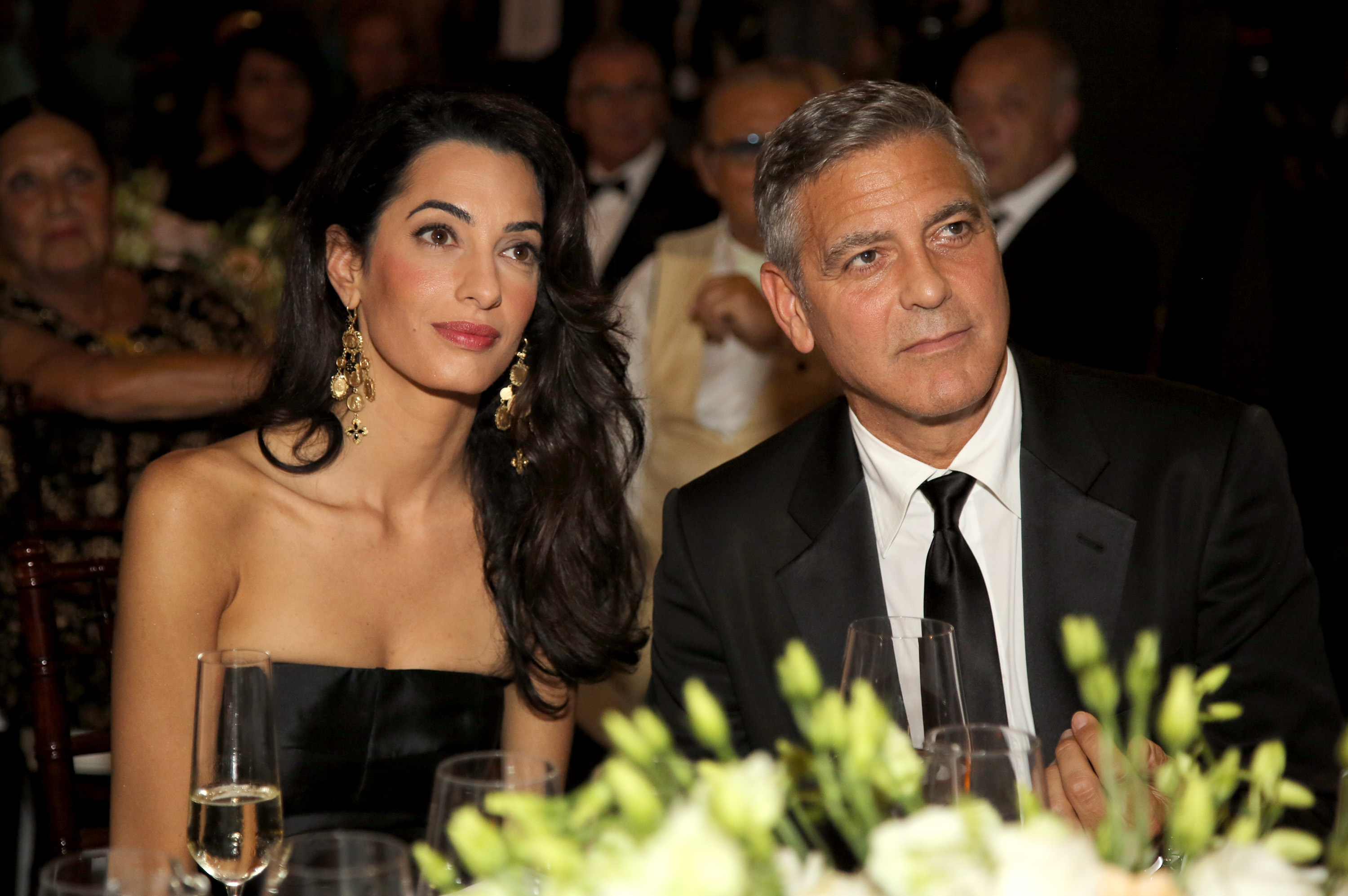 FLORENCE, ITALY - SEPTEMBER 07:  George Clooney (R) and Amal Alamuddin attend the Celebrity Fight Night gala celebrating C...