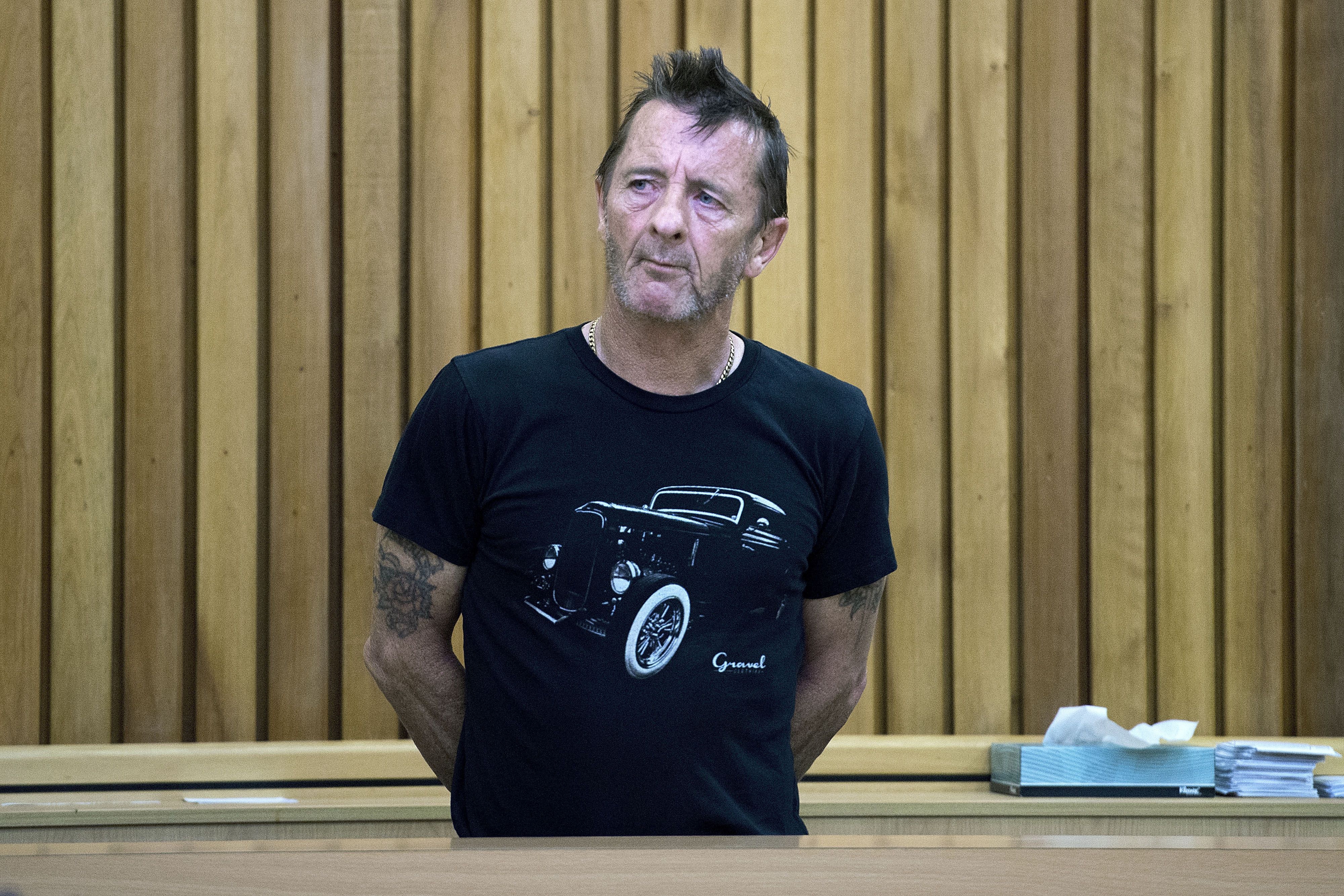 Former AC/DC drummer Phil Rudd stands in the dock as faces charges at the High Court in Tauranga, New Zealand on November ...