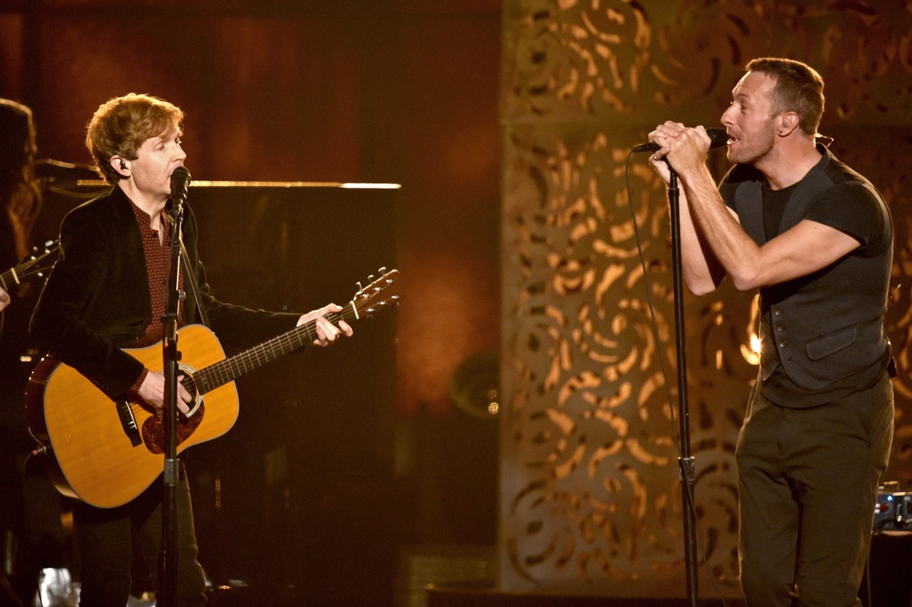 LOS ANGELES, CA - FEBRUARY 08:  Recording artists Beck (L) and Chris Martin perform onstage during The 57th Annual GRAMMY ...