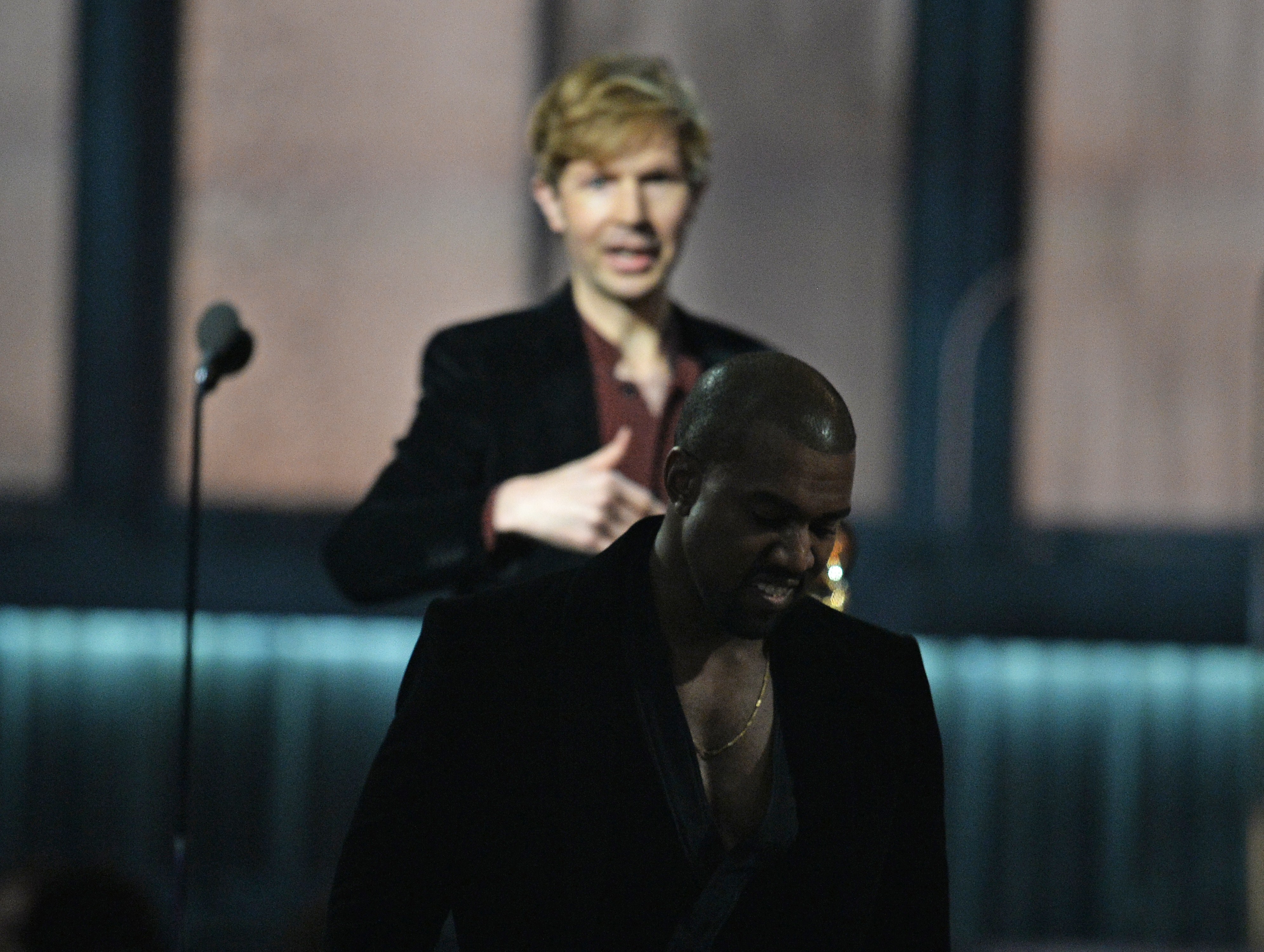 Winner for Album Of The Year Beck (L) reacts as Kanye West leaves the stage at the 57th Annual Grammy Awards in Los Angele...